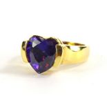 An amethyst set heart shaped ring, with central heart shaped dark purple amethyst,