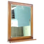 A mahogany dressing mirror, with a moulded frame, bevelled rectangular plate, above a shelf or