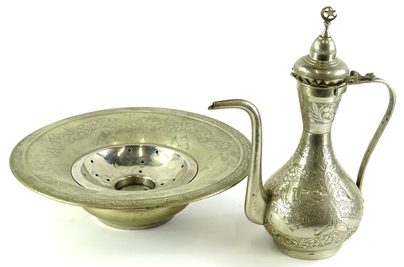 An Islamic nickel silver coffee pot, and a similar flared bowl, each decorated with scrolls,
