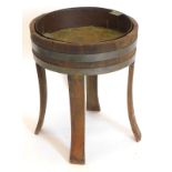 A mahogany and brass coopered plant stand, with four splayed legs and a brass liner, 49cm high, 41cm
