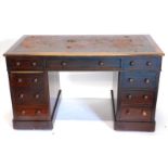 A late 19th/early 20thC oak pedestal desk, the rectangular top with a brown leather inset and a