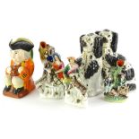 A collection of Staffordshire, to include a Toby jug, decorated with an orange coat etc., 23cm high,