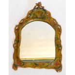 A 19thC Venetian wall mirror, the scroll shaped frame painted with a figure to the crest and with