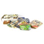 A large quantity of cigarette cards, books of cigarette cards, trade cards, tea cards, shelf