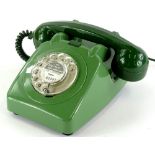 A 1966 GPO 706 green telephone, fitted with bell on/off switch.