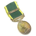 A George V Territorial Army Efficiency Service medal with bar, awarded to a 3949353 Corporal A.E