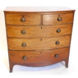 An early Victorian mahogany bow fronted chest of drawers, the top with a crossbanded and ebony