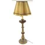 A Venetian type gilt and polychrome decorated table lamp, with bands of fruit, leaves, etc. and a