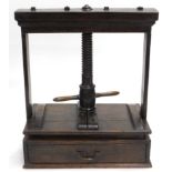 A late 18th/early 19thC oak linen or book press, with plain end supports, turned handles, above a