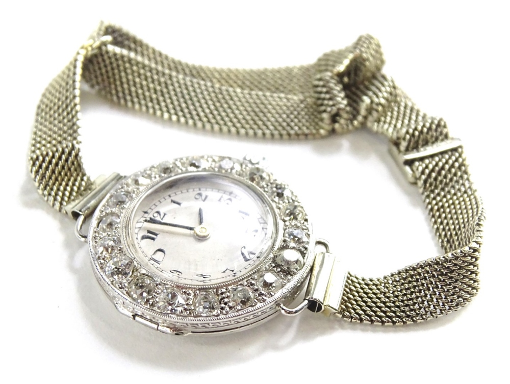 WITHDRAWN PRE-SALE BY VENDOR A ladies diamond set platinum wristwatch, on an 18ct white gold