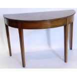 A 19thC mahogany demi lune table, with a reeded edge on square tapering legs, 114cm wide.
