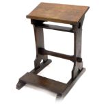 A late 19th/early 20thC oak church kneeler, with a slope top, on end supports with rectangular
