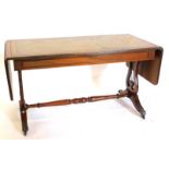 A mahogany coffee table, the rectangular top with green leather insert, drop sides, above a