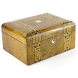 A Victorian walnut and parquetry workbox, the domed hinged lid with a vacant ivorine cartouche,