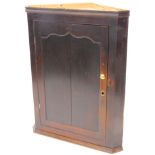 A 19thC oak corner cabinet, with a single panelled door, 111cm high, 86cm wide.