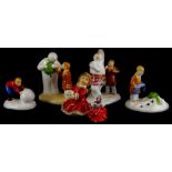 A collection of ceramic figures, to include three Coalport character snowman figures, a Goebel