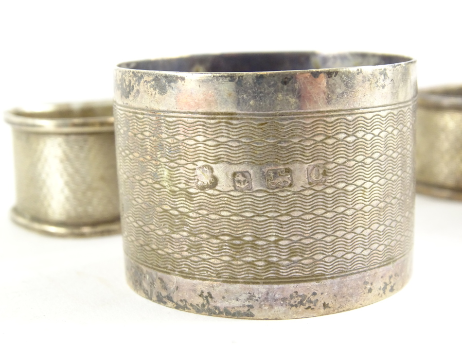 A collection of small silver, to include a silver and part antler single knife rest and three napkin - Image 2 of 2