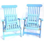 A pair of blue painted folding steamer or garden chairs (AF).