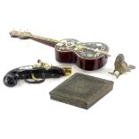 A souvenir simulated tortoiseshell novelty guitar music box (AF), a set of base metal lozenge shaped