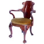 A 19thC mahogany open armchair in the manner of Gillows, the figured shaped back joined by