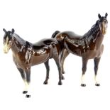 A Beswick horse, brown colourway, white face, standing, printed marks beneath, 20cm high and another