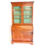 A Victorian mahogany cylinder bureau bookcase, the top with a moulded cornice with two glazed doors,
