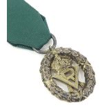 A Victorian silver Volunteer Officers medal or decoration, with green ribbon, awarded for long