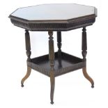 An Edwardian mahogany window table, the octagonal top with a fluted frieze, on turned reeded legs