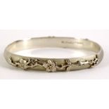 A silver cuff bracelet, marked 2005 Tiffany & Co, 925, with raised floral design, 6cm diameter,