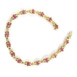 A ruby and diamond set bracelet, with floral type design, centred by ruby, with tiny diamond breaks,