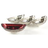 A set of four late 18th/early 19thC silver boat shaped dishes, each with a pierced edge and sunburst