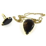 A smoky quartz set pendant and ring, the ring with tear drop cut smoky quartz, in a yellow metal