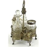 A Victorian five division cruet stand, with a pierced handle and sides, on shaped legs with ball and