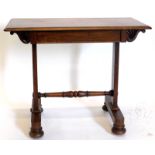 A small William IV mahogany library table, the rectangular top with a frieze drawer, opposing a