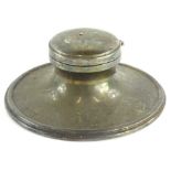 A George VI silver Capstan inkwell, the hinged lid enclosing a clear glass liner, loaded,