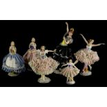 A collection of six continental porcelain crinoline ladies, to include a Spanish dancer with black