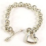 A silver heart and arrow bracelet, marked Italy Tiffany & Co 1984, 22cm long overall, in Bergerie