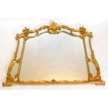 A 19thC giltwood and gesso cartouche shaped wall mirror, decorated overall with foliate scrolls, 'C'