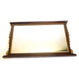A 19thC rosewood overmantel mirror, with a moulded cornice, above a rectangular bevelled plate, with