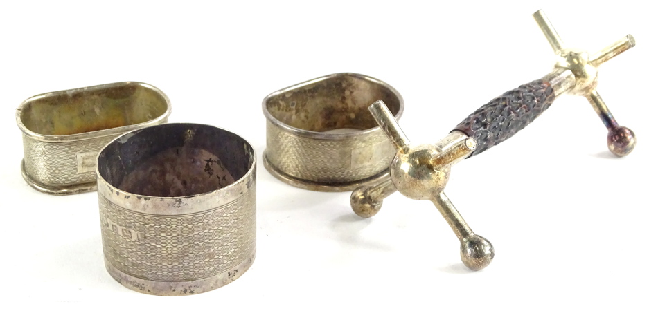 A collection of small silver, to include a silver and part antler single knife rest and three napkin