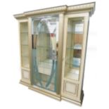 An Arredo Italian simulated marble and parcel gilt breakfront display cabinet, the top with a