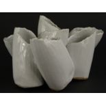 A studio pottery barnacle type vase, with seven separate receptacles and a white glaze, unmarked,