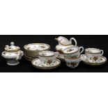 A Copeland Spode Rockingham pattern part tea service, each piece decorated with fruit,