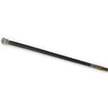 A part woven leather riding crop, with white coloured metal mounts, unmarked, 75cm long.
