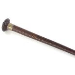 A woven leather riding crop, with silver collar stamped Champion and Wilson London, marks