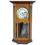 A mahogany cased wall clock, the silvered dial with Arabic numerals, 70cm high.