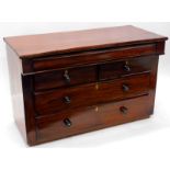 A Victorian mahogany chest of drawers, the rectangular top above a long frieze drawer with two short