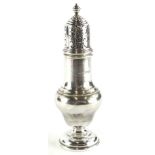 A George V silver baluster shaped sugar castor, with turned finial, domed foot, Chester 1930, 3½
