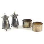 A collection of small silver, to include two hammered napkin rings and two pepper pots, 4oz.
