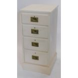 A pine narrow chest of drawers, with a plain top above four drawers, each with inset brass